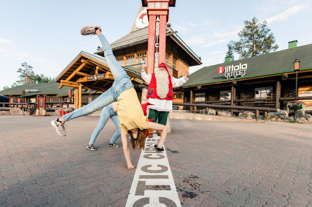 Santa Claus with kids on the Arctic Circle at Santa Claus Village in Rovaniemi Lapland Finland